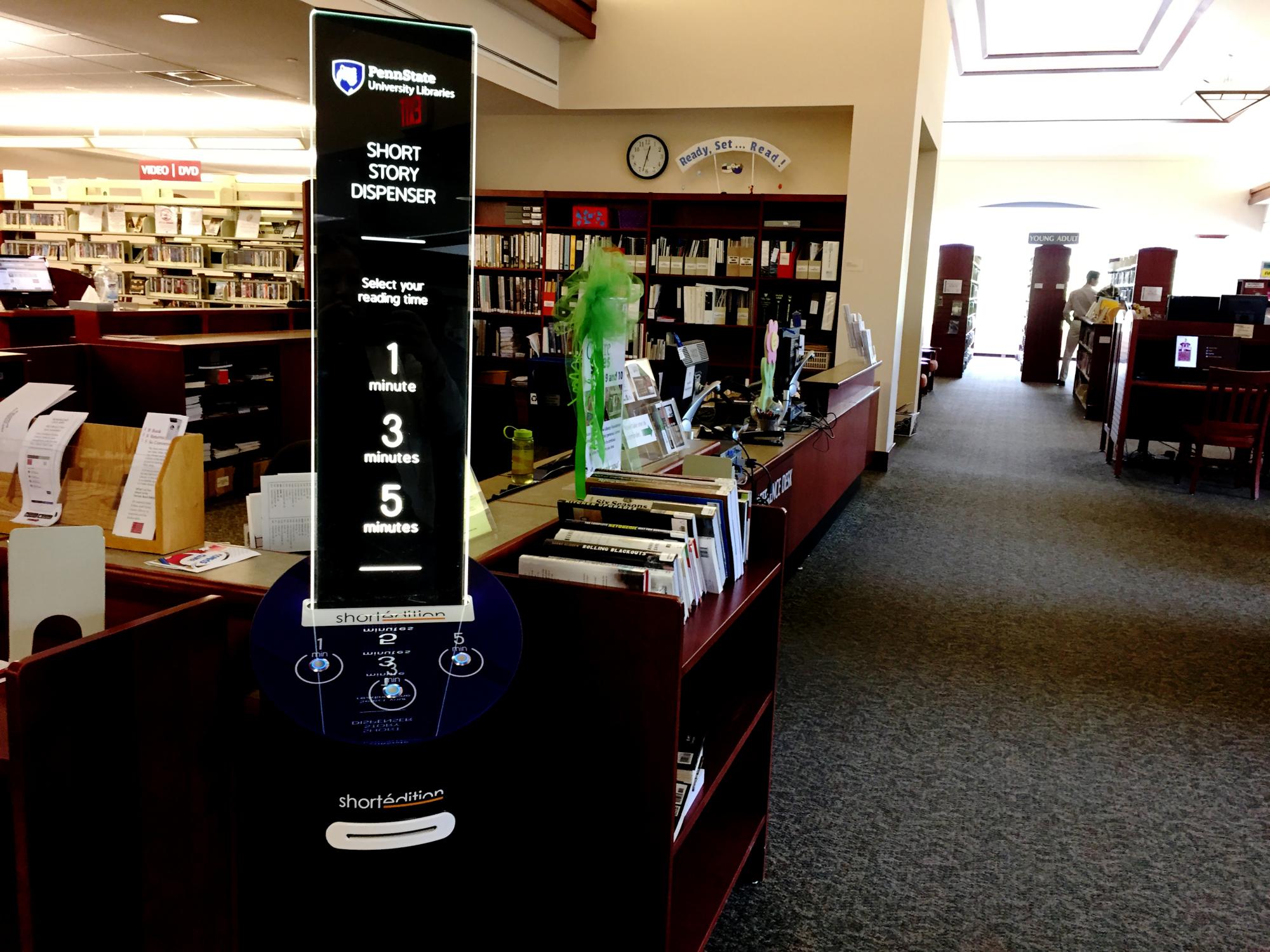 Penn State/Short Edition blue short story dispenser at front of adult services desk on second floor of Schlow Centre Region Library, State College, Pennsylvania