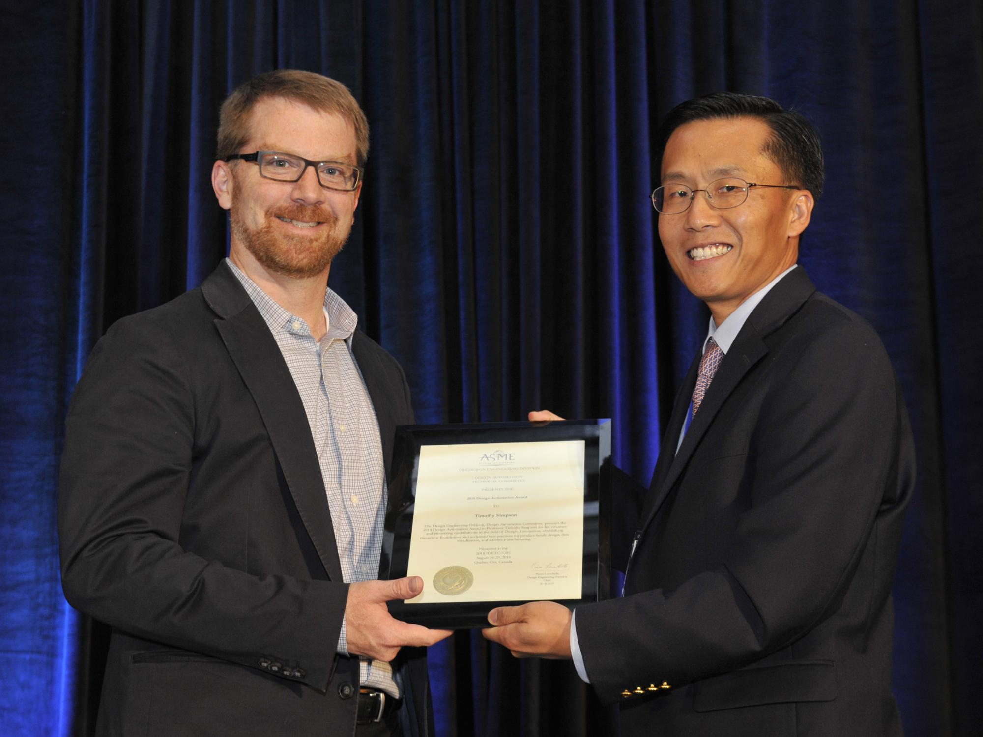 Simpson receives the ASME Design Automation Award.