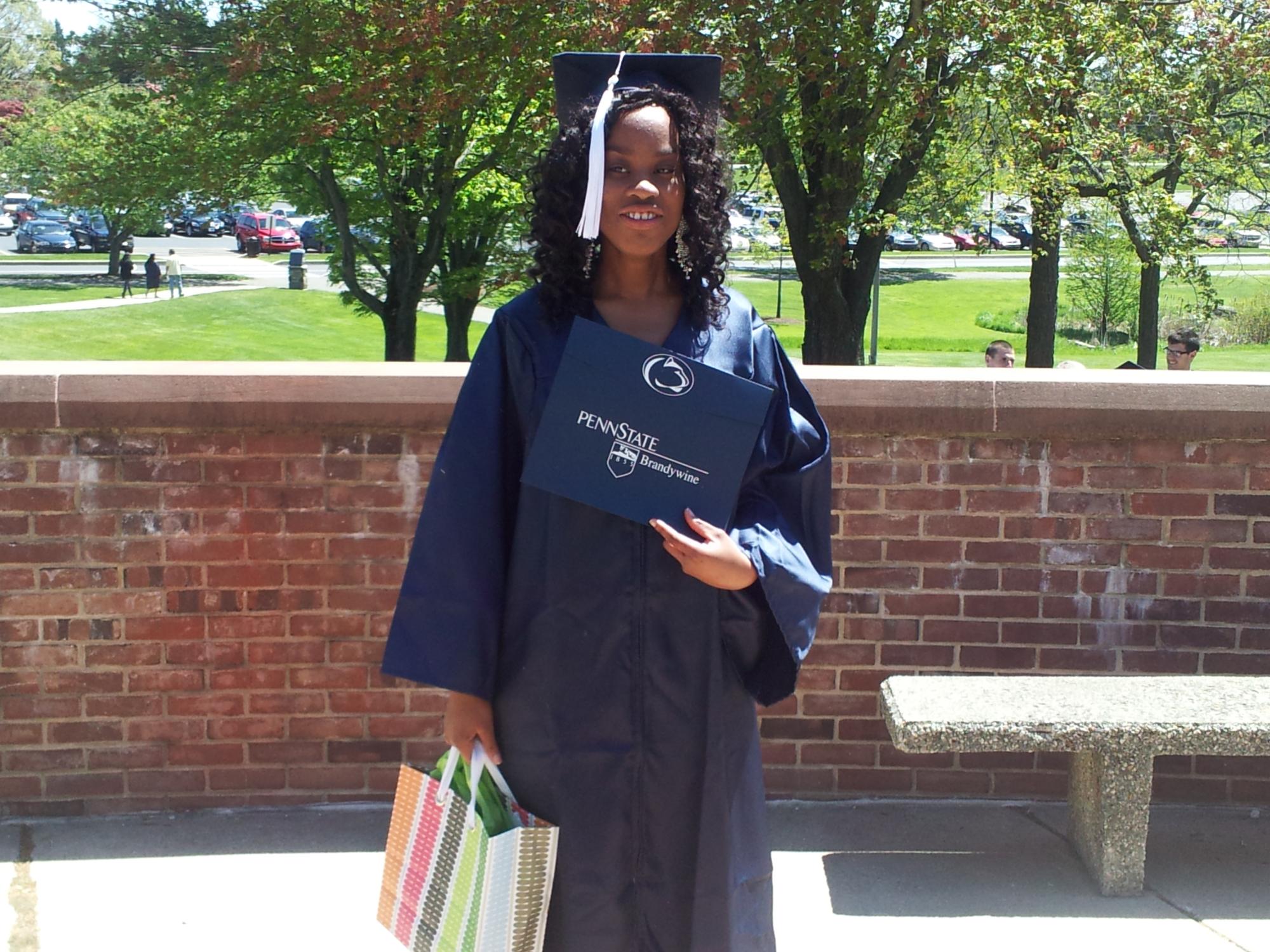 Penn State Brandywine graduate Sophia Obinyan in her cap and gown at Spring Commencement 2013.