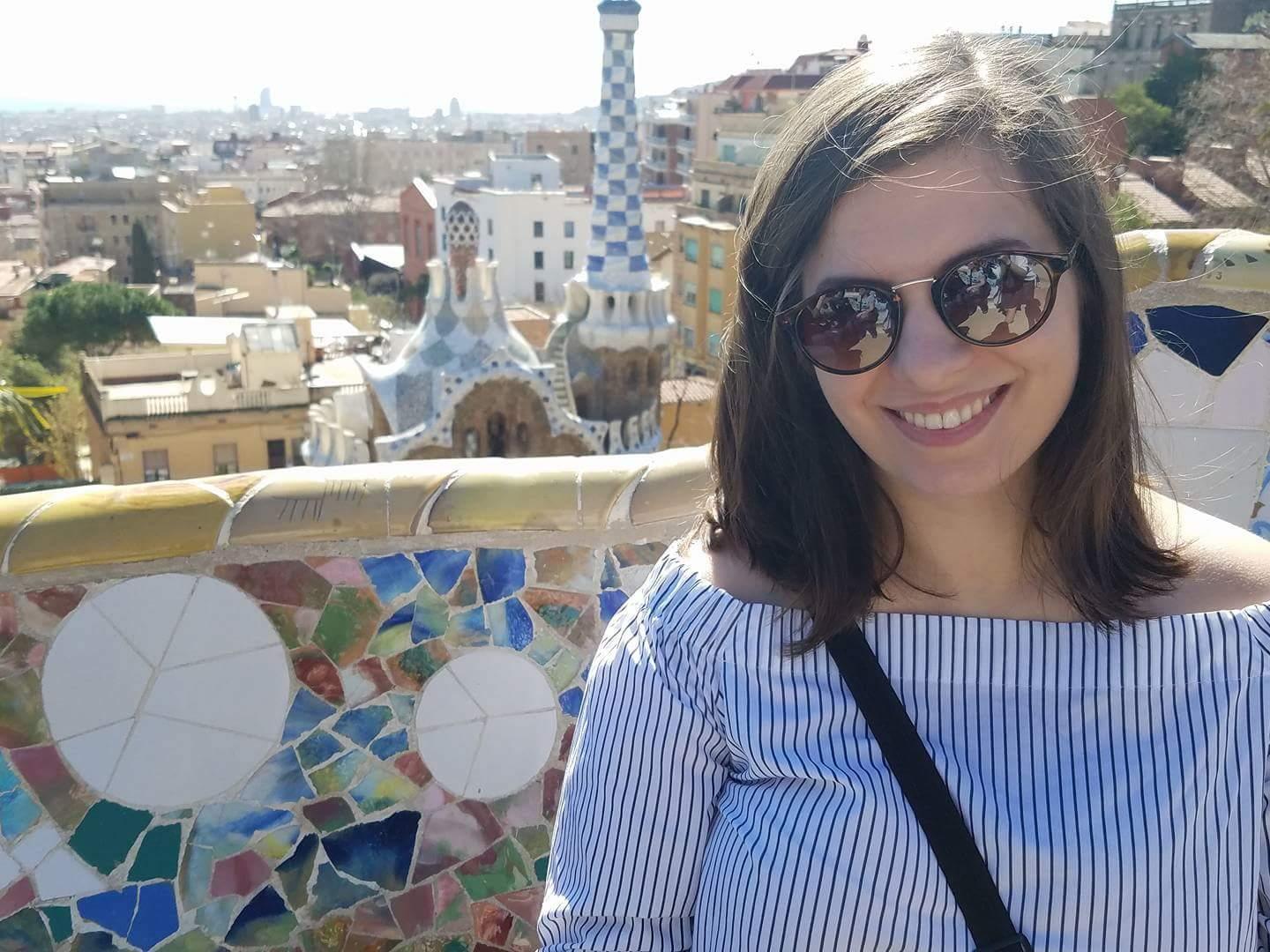 Student posed on a bench in Park Guell