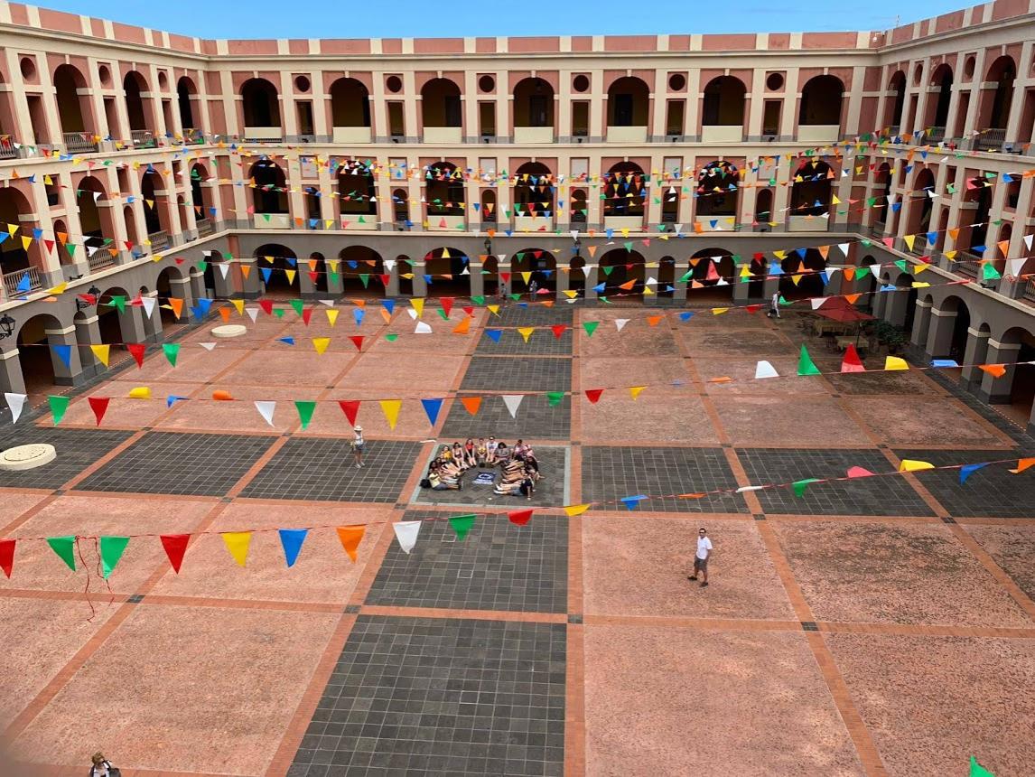 students laying down in square in Puerto Rico infantry barracks