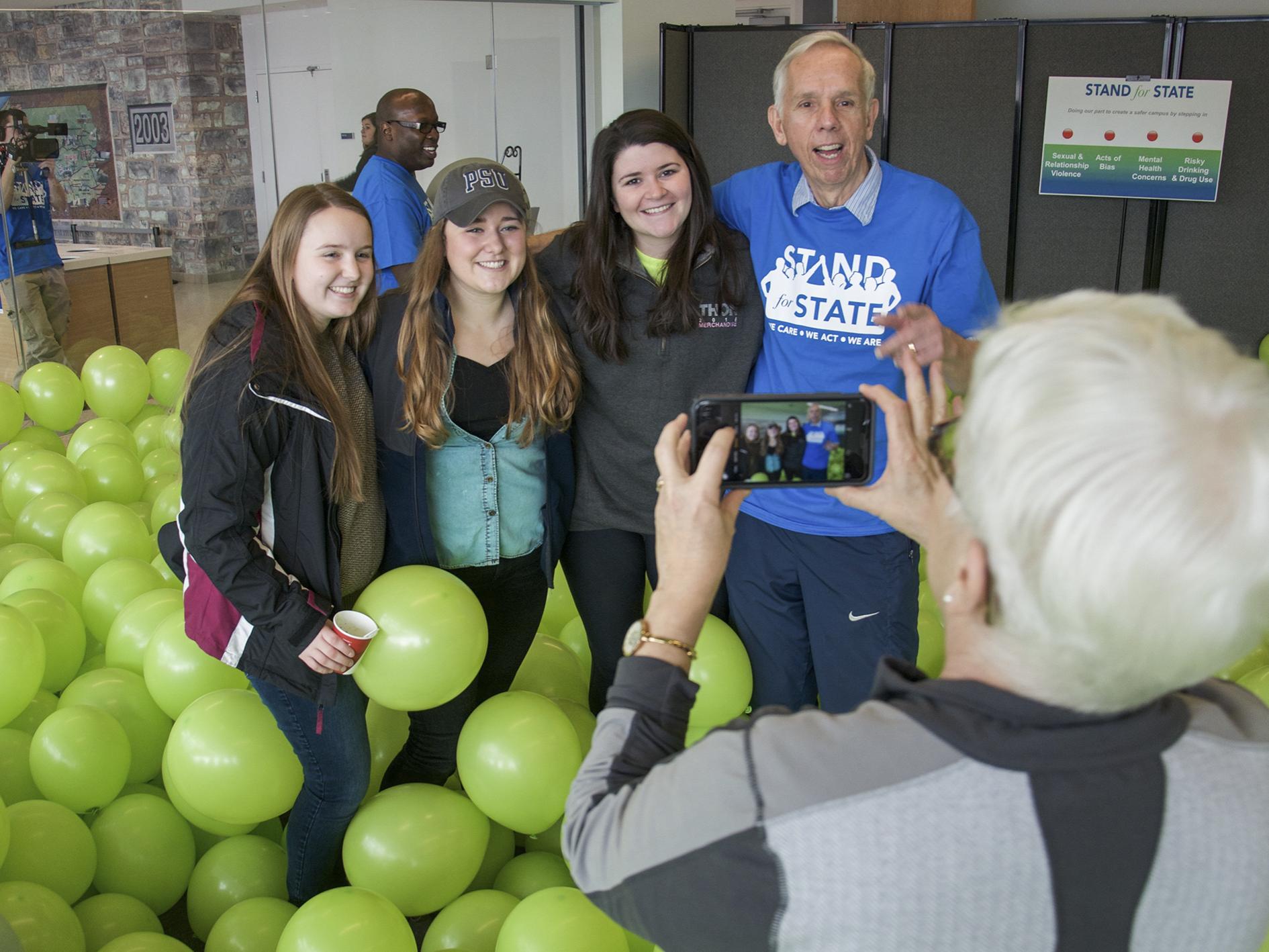 Mike the Mailman posing with students