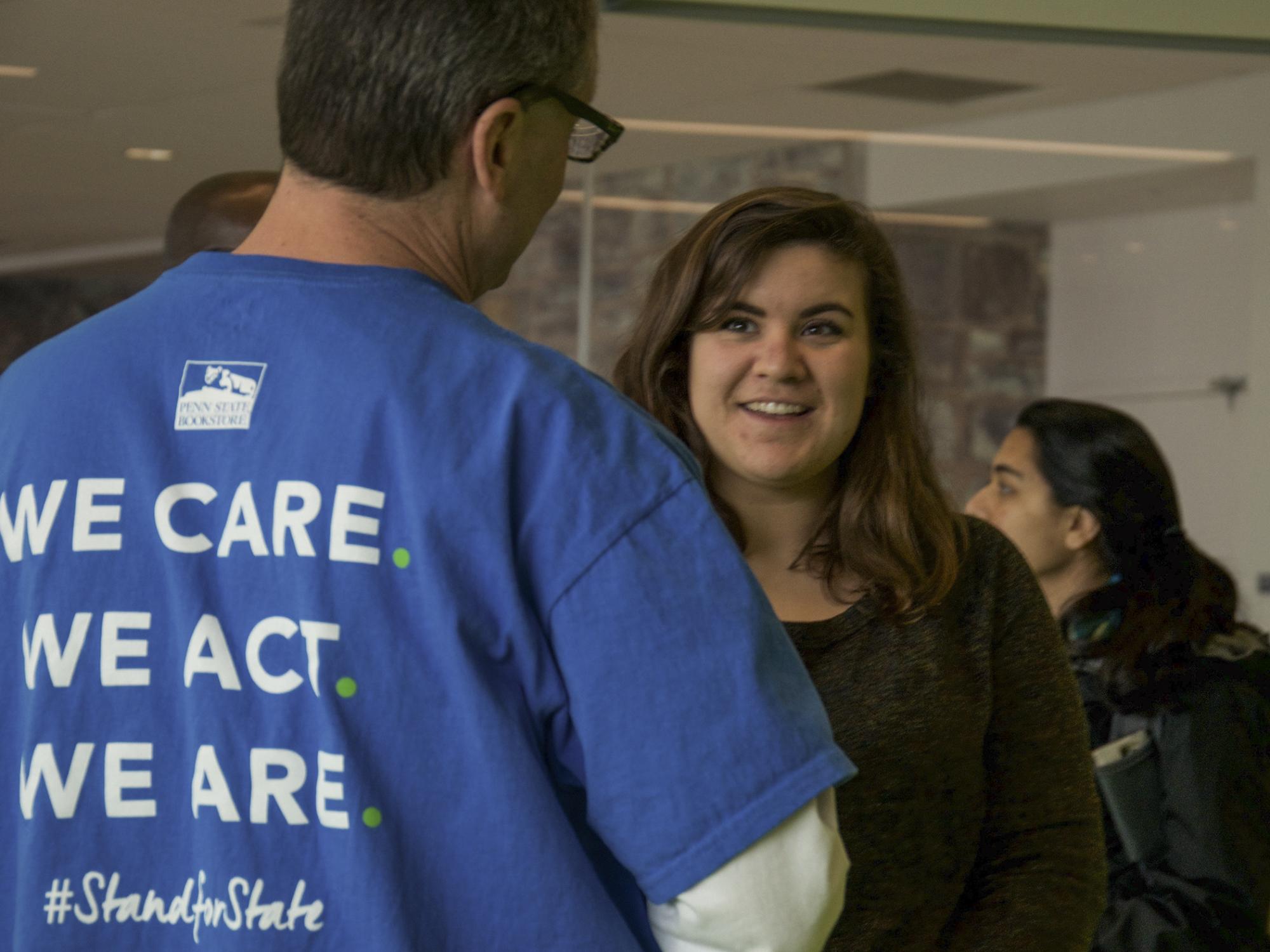 A staff member talking to a student 