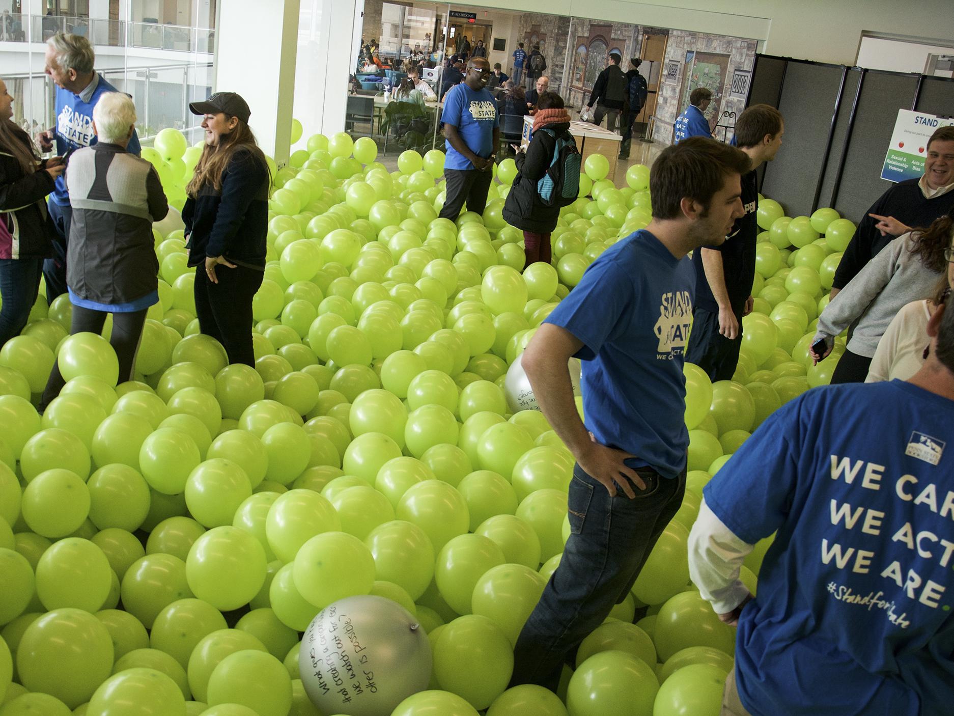 Students and staff talking in the Balloon Room 
