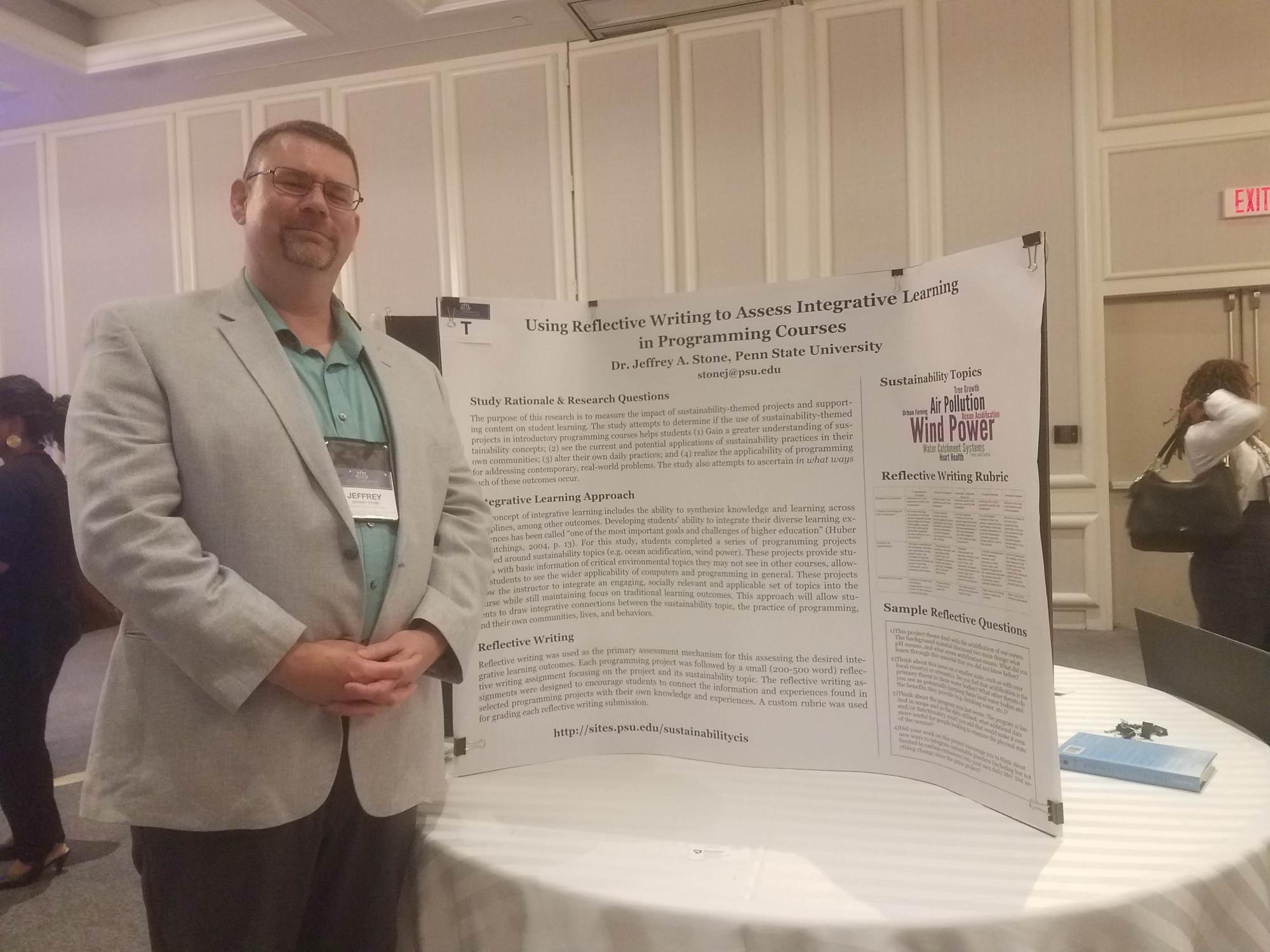 man next to a poster