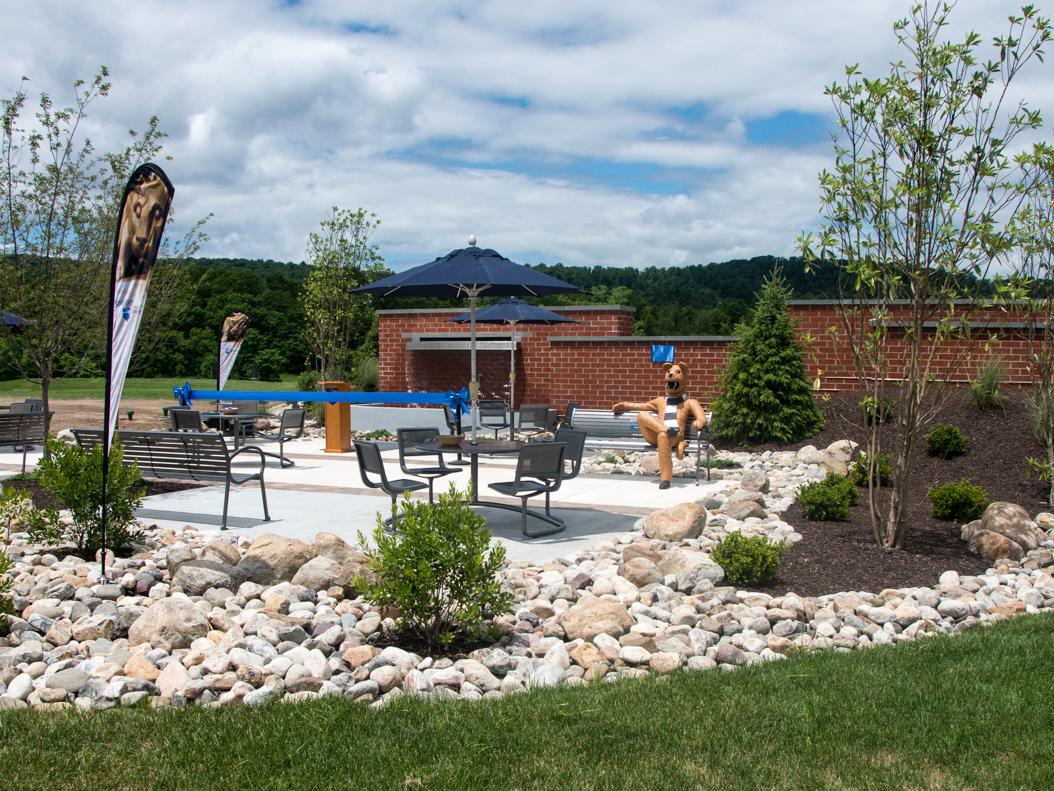 The new student plaza featuring a water element, lion bench, and ample seating.