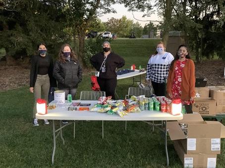 students staffing a table
