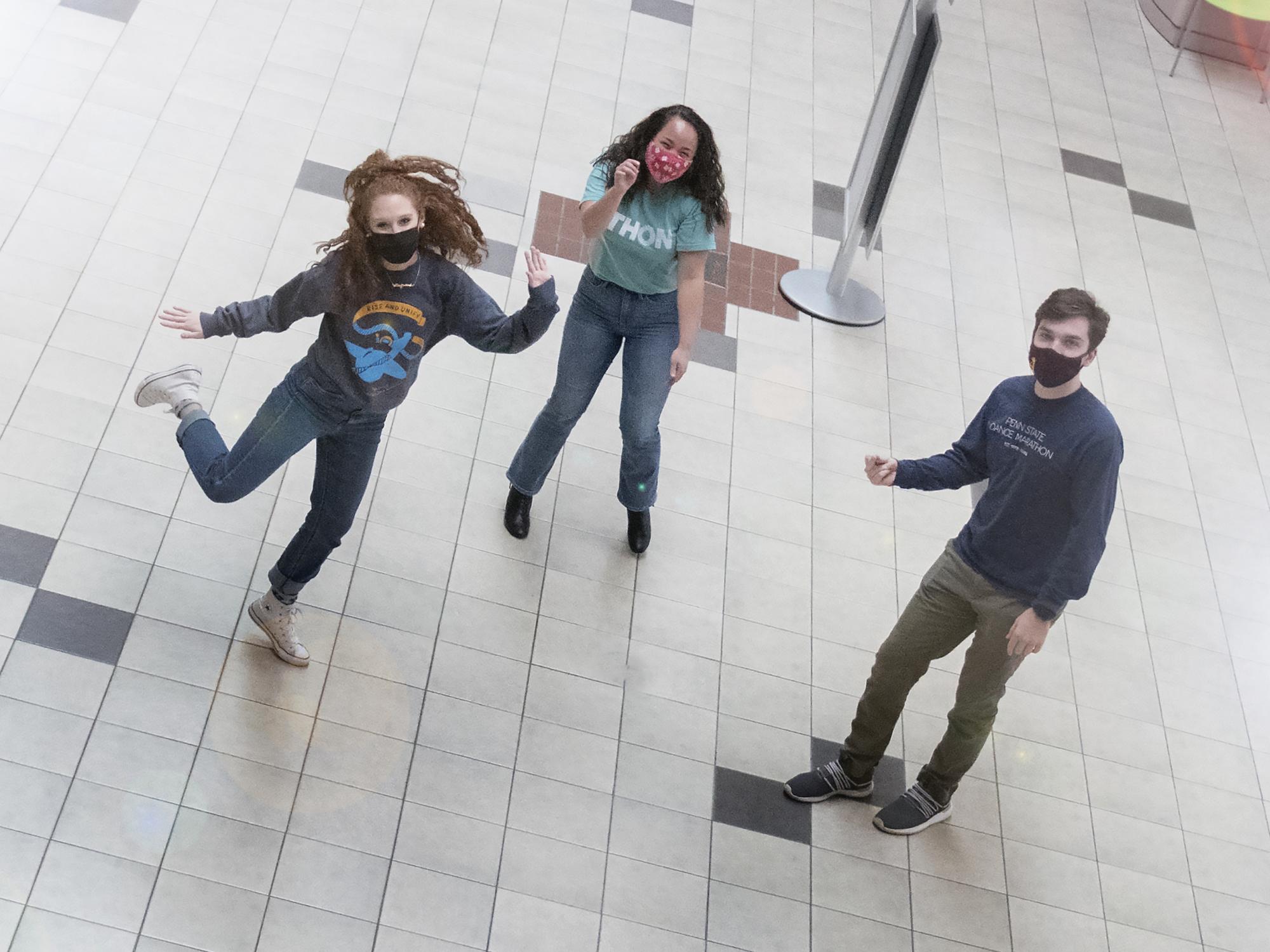 THON dancers Addison Albert, Jasmine Forsberg and Andy Mader dance at a safe distance from each other while wearing masks.