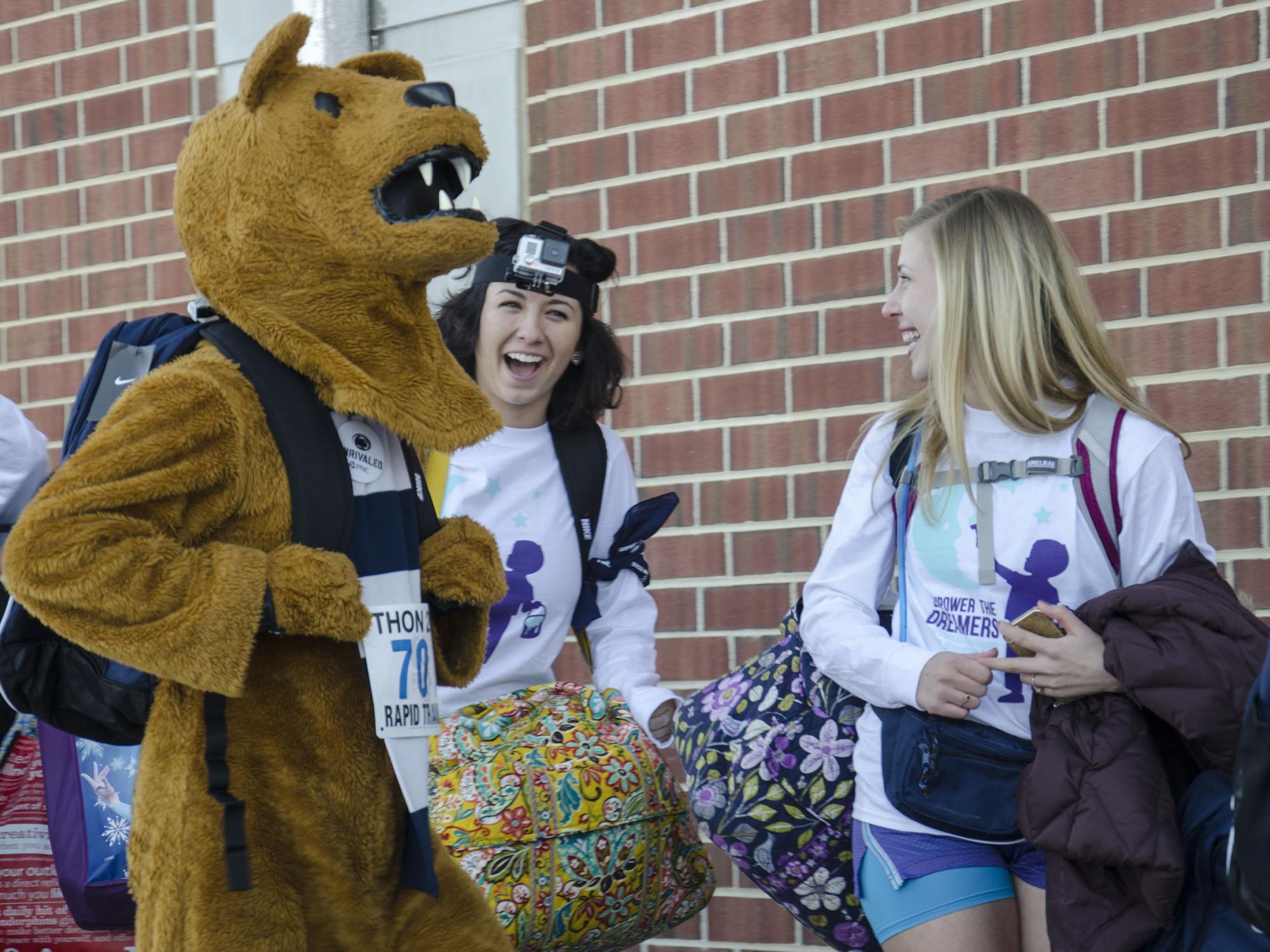 The Penn State Nittany Lion and other dancers making their way into the Bryce Jordan Center for THON 2015