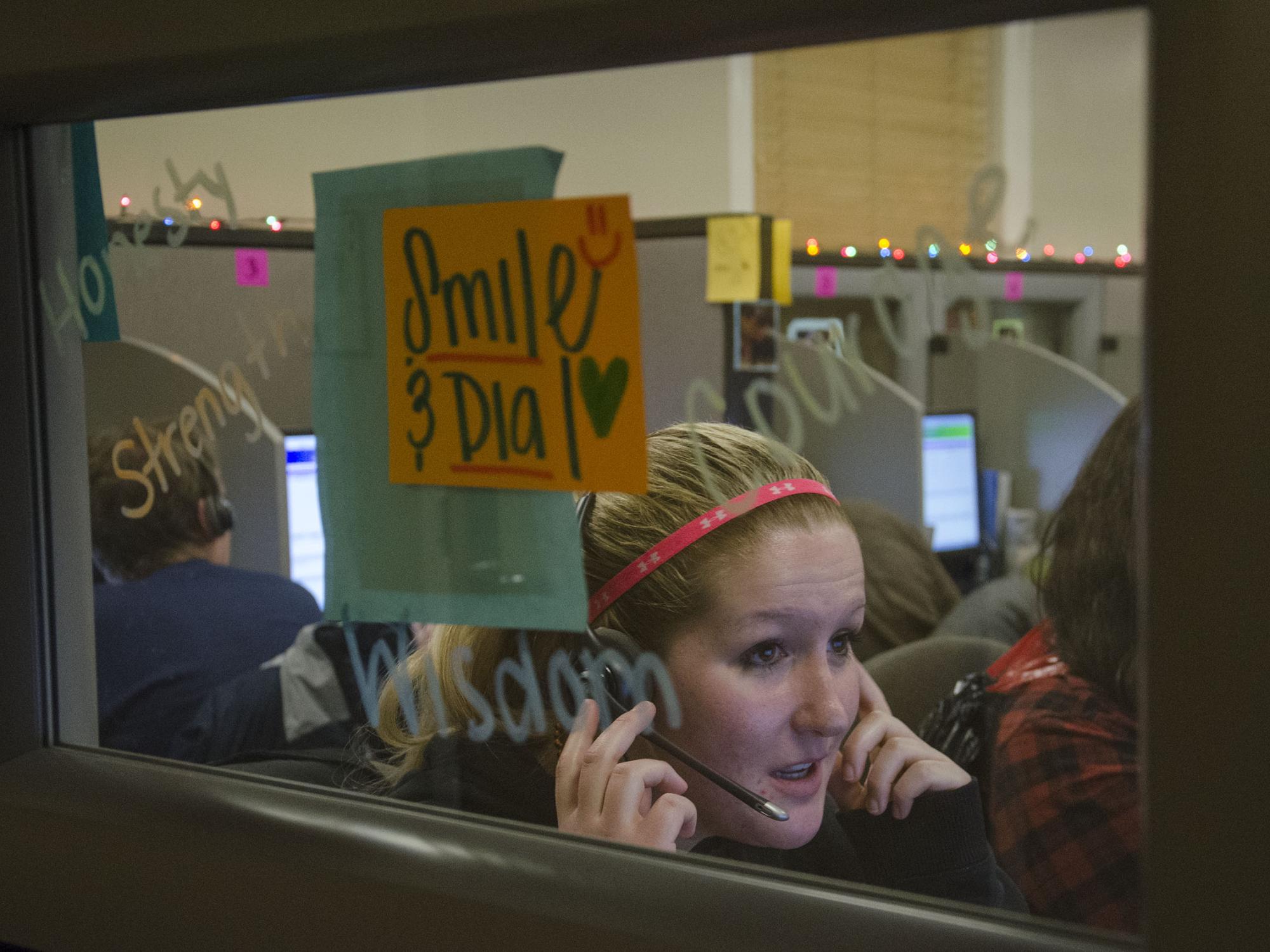 A student seeks pledges on the phone