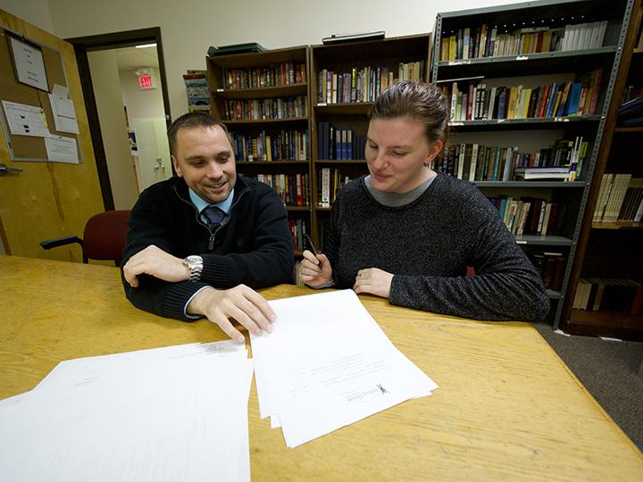 man and young woman meeting in a library
