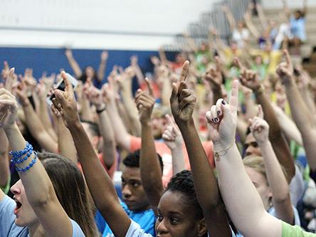 Penn State Mont Alto students hold up their hands during Jon Vroman's talk.