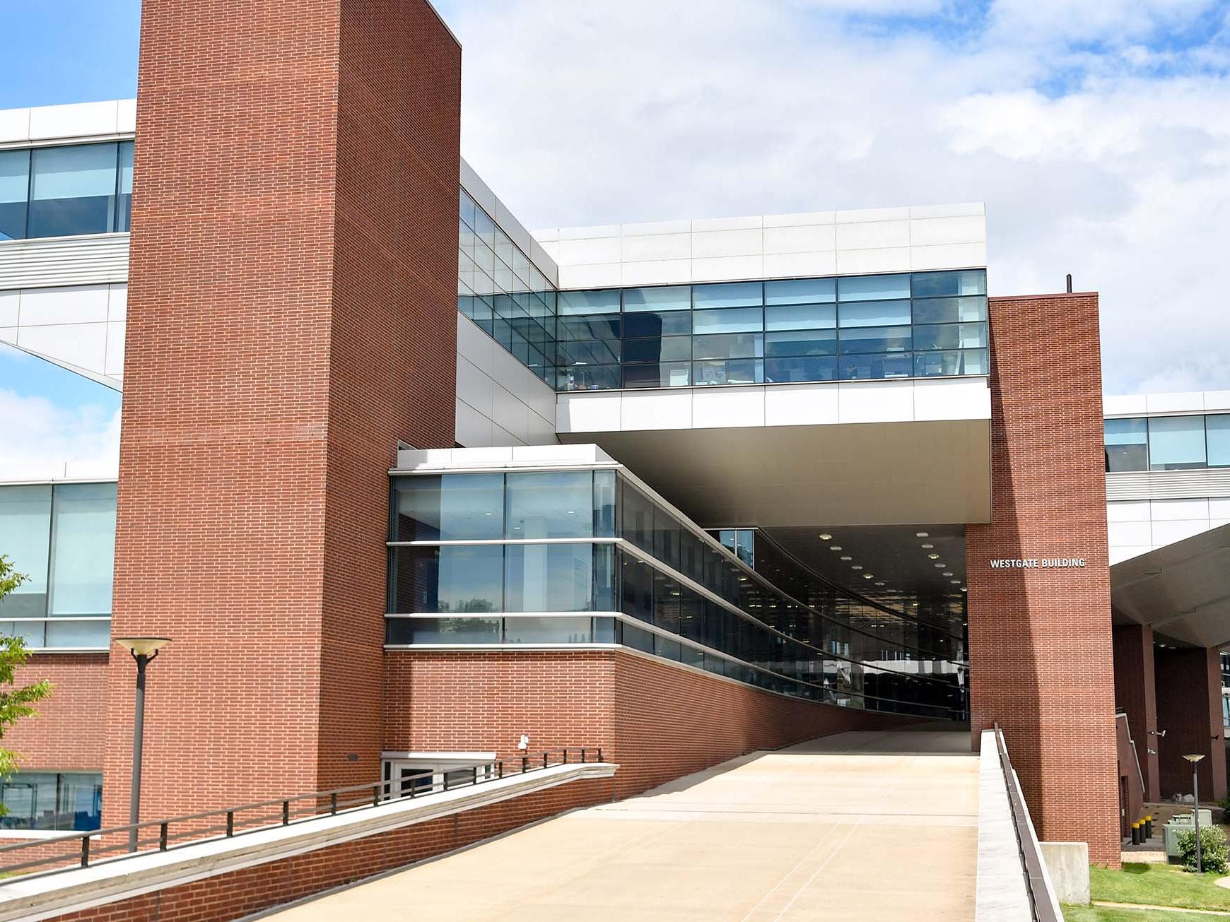 medium long shot of brick campus building