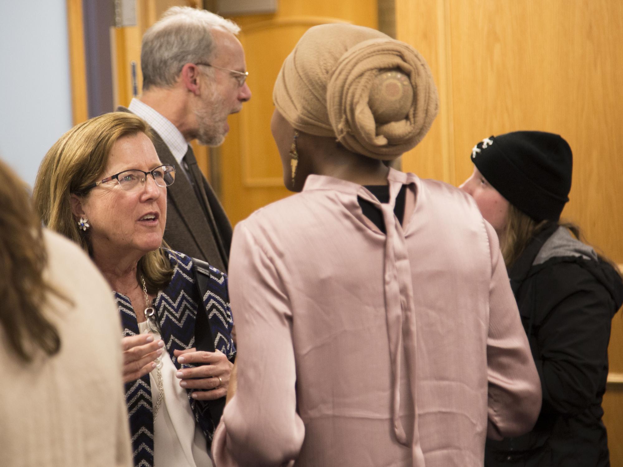 Debbie Montick talks to a student at the networking reception