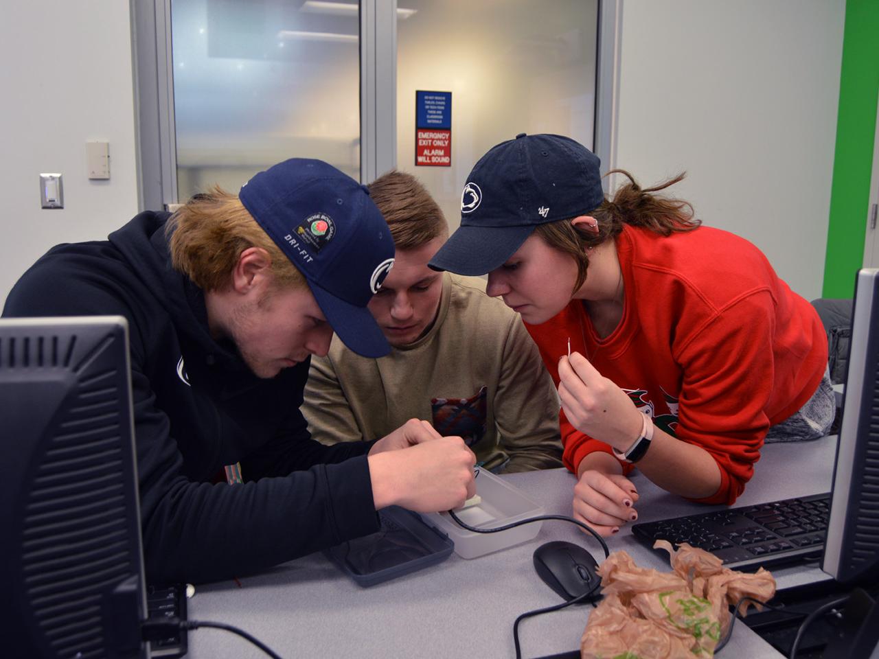 students building seismograph
