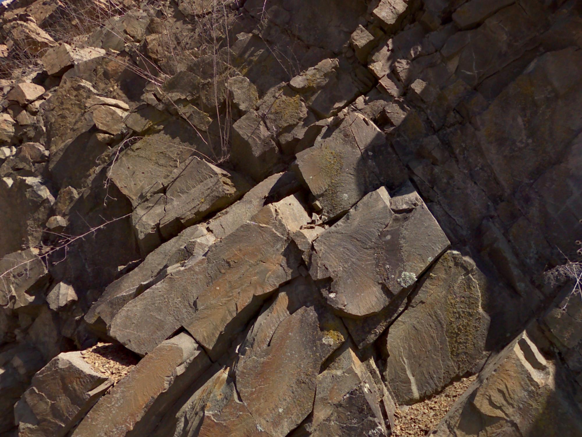 layers of rock tipping to the left