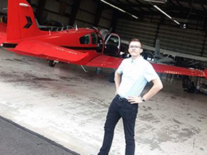 student near airplane