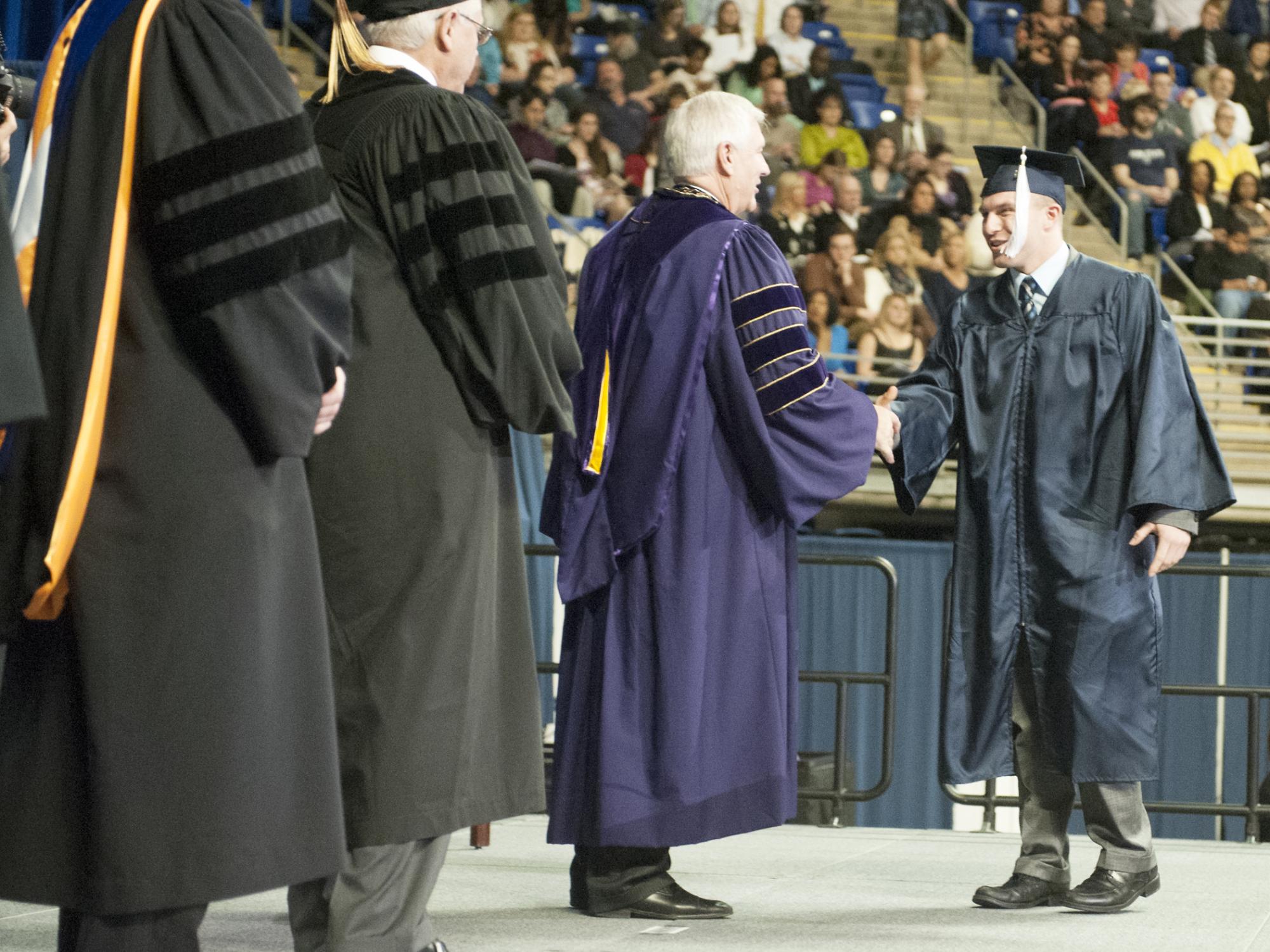Ian Kenney receiving his diploma
