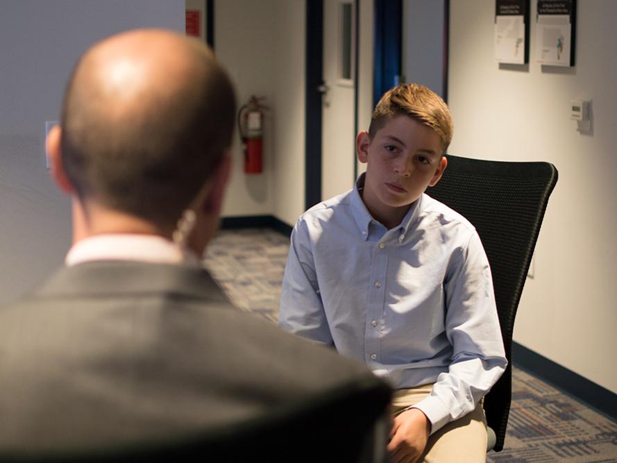 Cullen listens as Bernie Rayno shares his experiences with becoming a meteorologist.