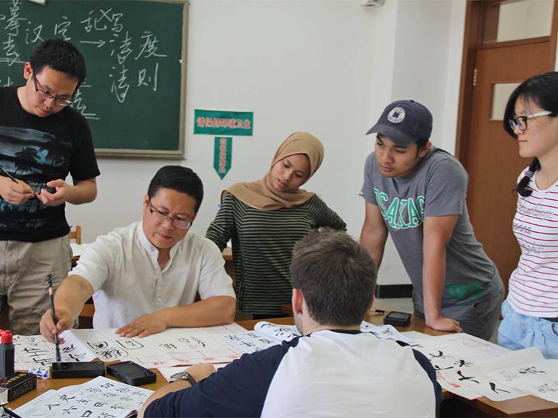 Students learn calligraphy