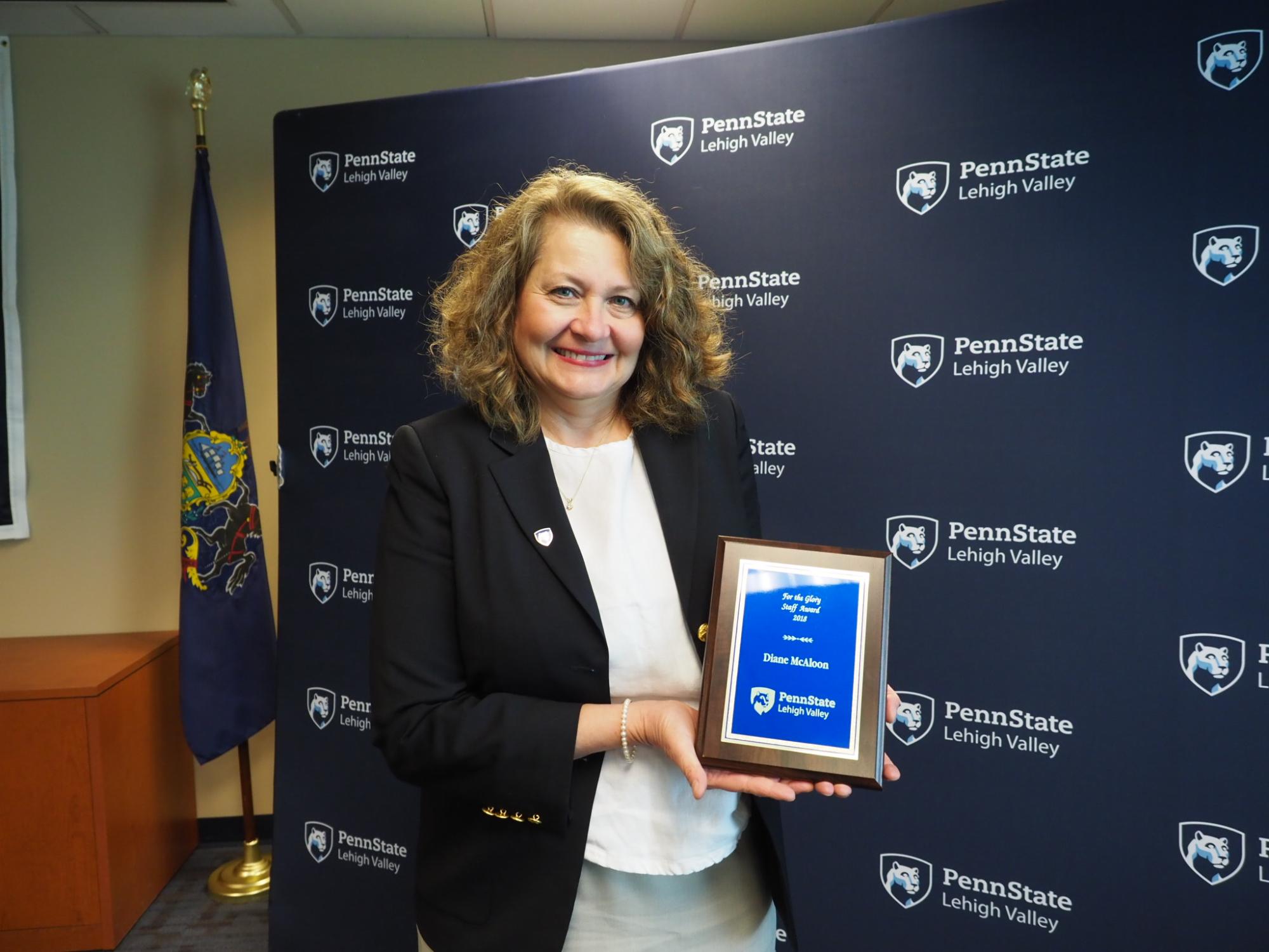 woman with a plaque