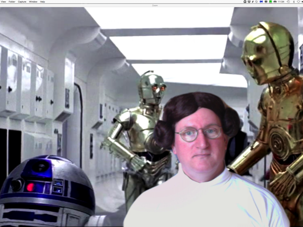 man dressed as Princess Leia from Star Wars movies standing in front of Star Wars-themed virtual background 