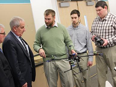 engineering students with drone