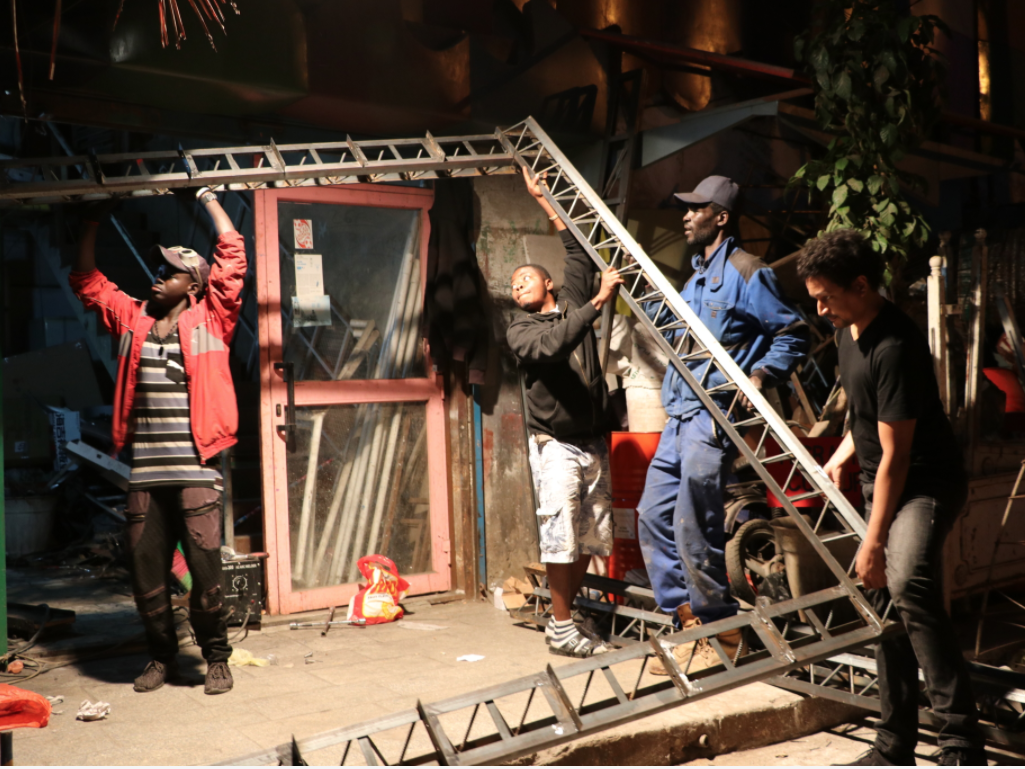 men set up a module in Dakar, Senegal