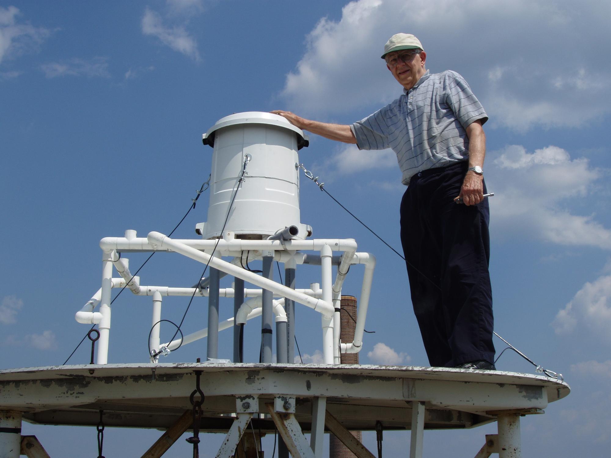 Tony Shirer standing next to completed lightning monitor