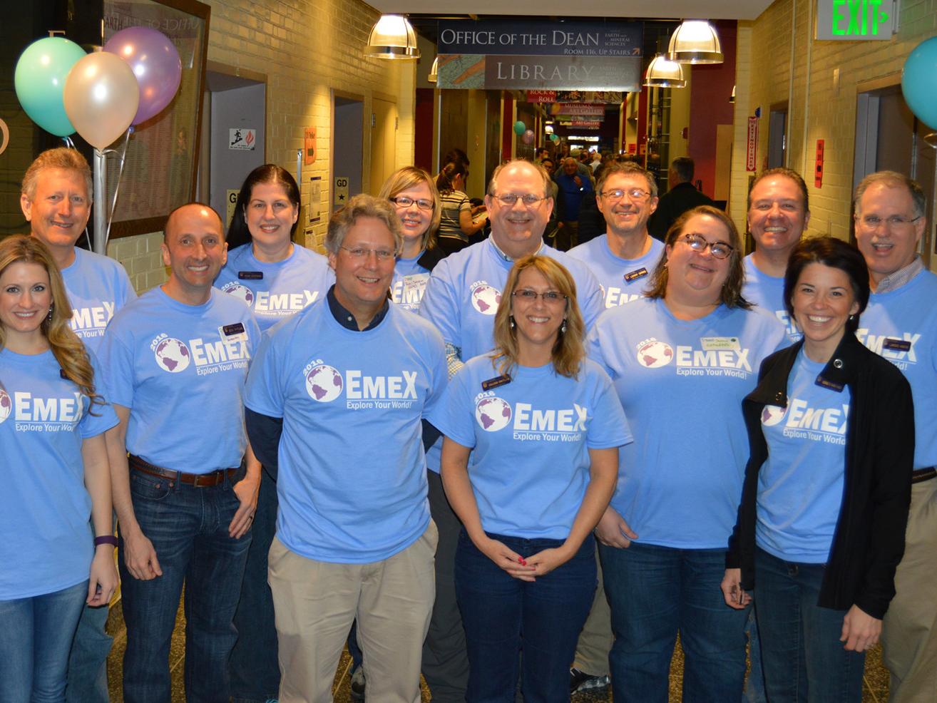 people standing in hallway posing for photo