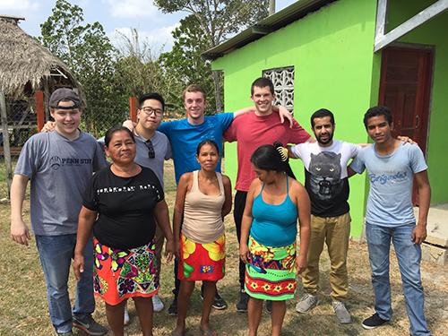 Penn State students pose for a picture with some of the local business owners they met in Panama. 