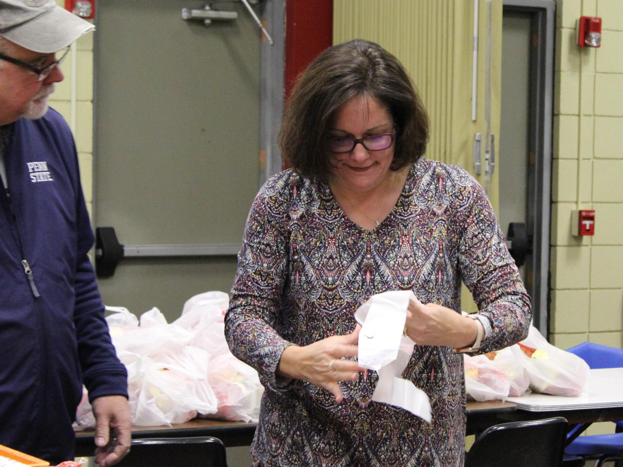 Chancellor Jacqueline Edmondson helping package meals. 