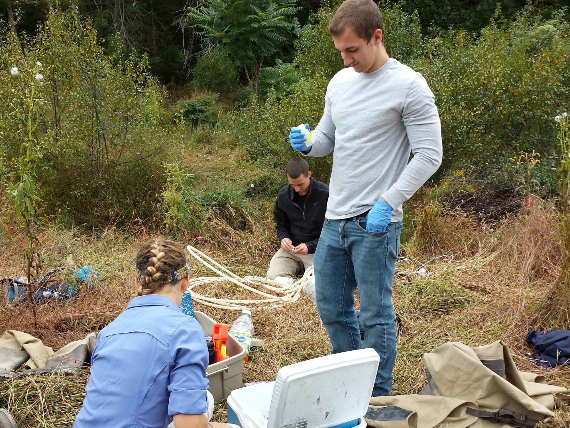 Penn State students collect water samples 