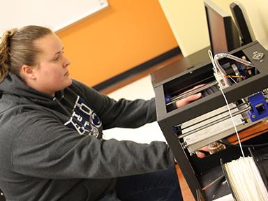 student at 3d printer