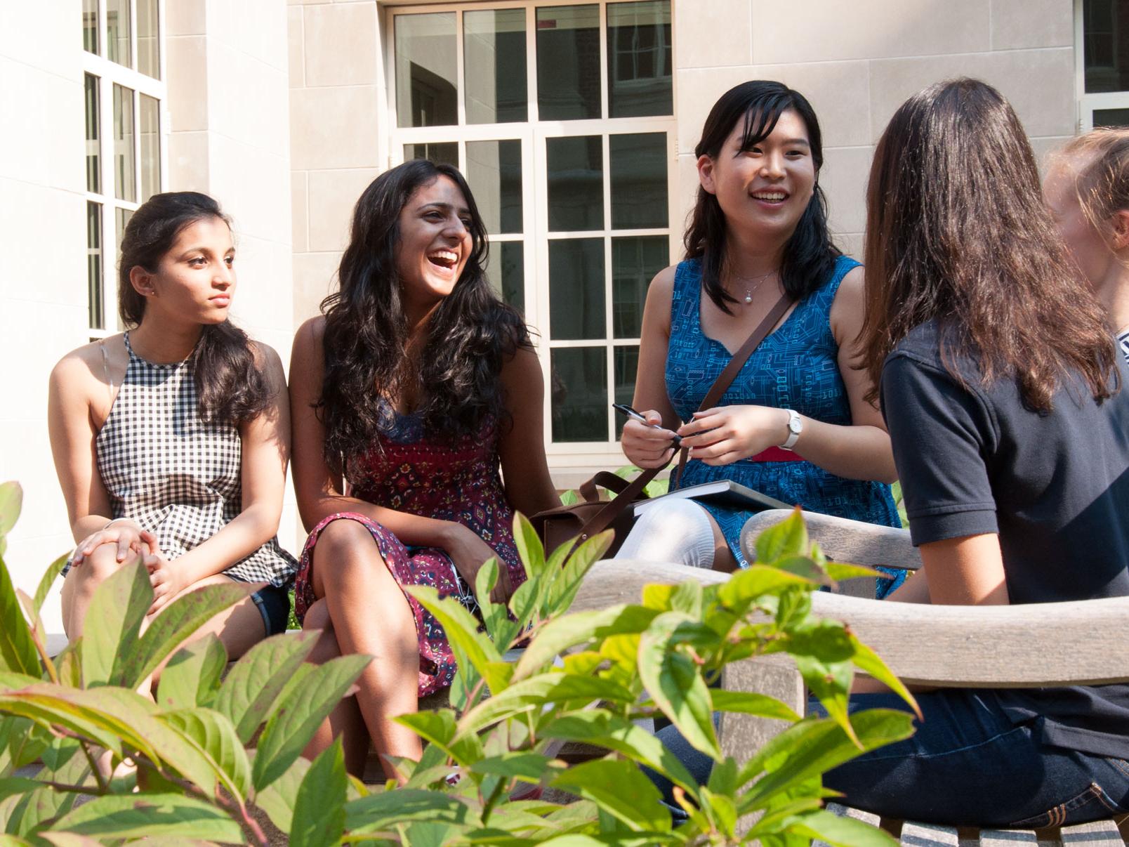 Association of Women in Computing members sitting outside
