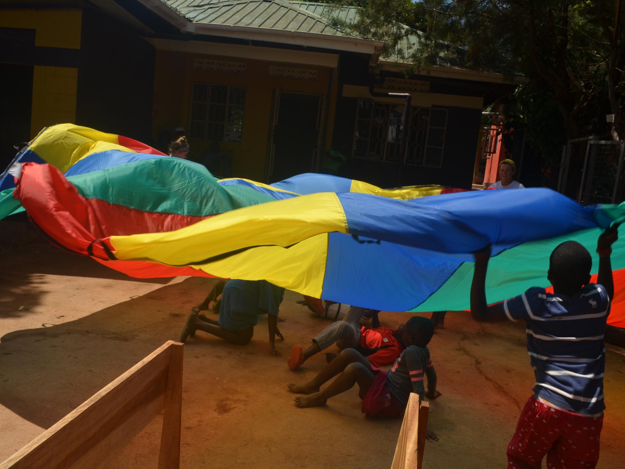 Children playing with a parachute