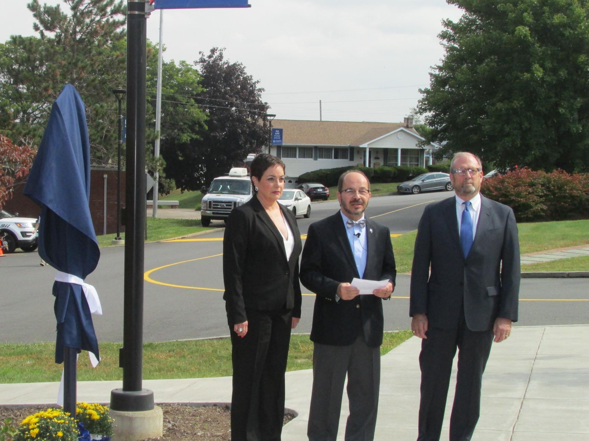 group at historical marker before unveiling