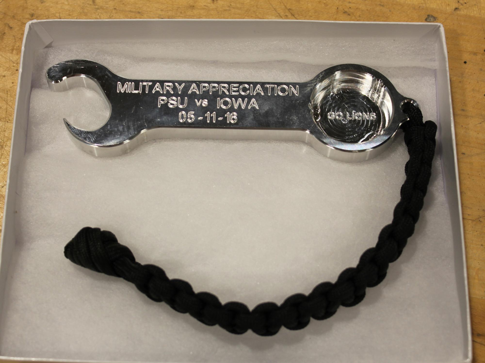 The opposite side of a bottle opener/wrench made in the Factory for Advanced Manufacturing Education within the Harold and Inge Marcus Department of Industrial and Manufacturing Engineering for Military Appreciation Day donors. 