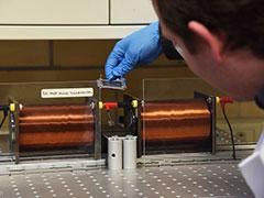 Aerospace engineering Ph.D. candidate Mychal Spencer shown working with a solenoid coil system that he developed in the Penn State Nano-/Micro-engineered Materials Lab. The system provides oscillating magnetic fields with low frequency.