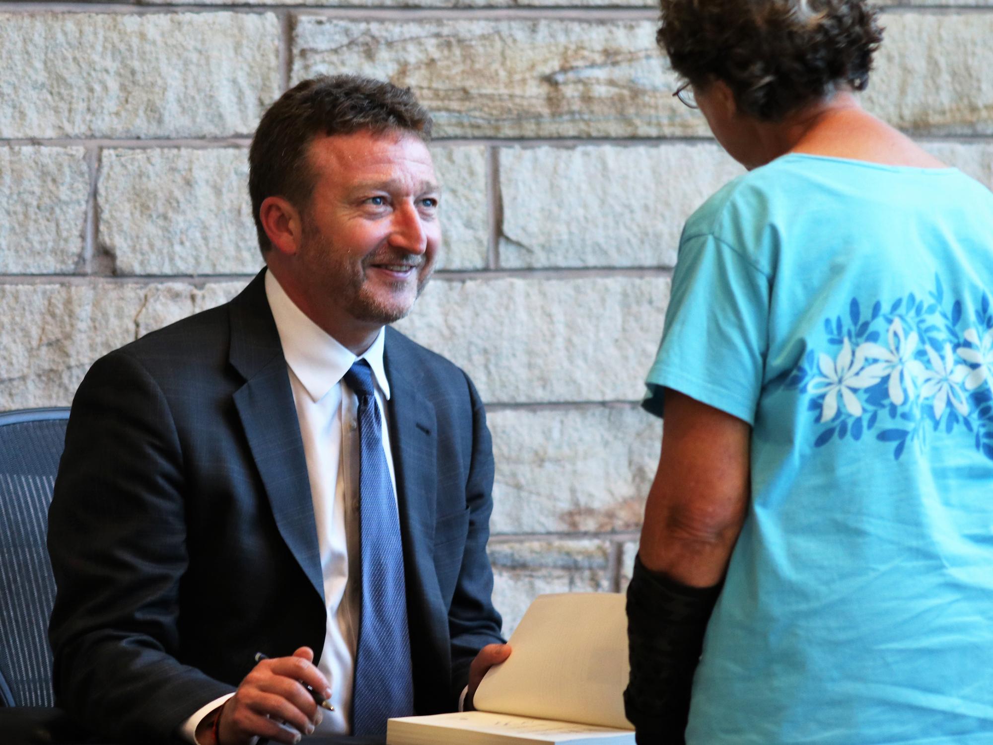 New York Times correspondent and author Steve Lee Myers signs copies of his book "The New Tsar: The Rise and Reign of Vladimir Putin" in the Lewis Katz Building.