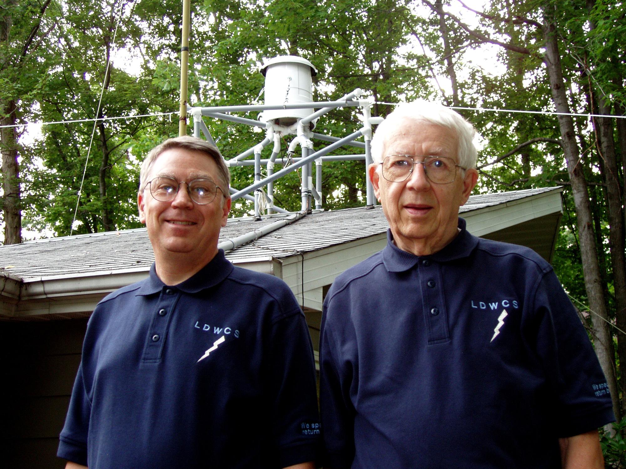 Nels Shirer stands with his father