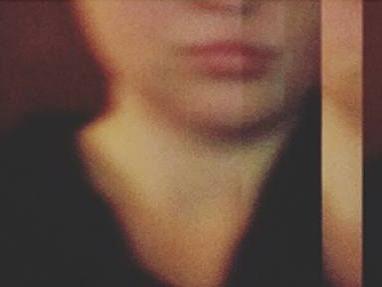 A blurry, panoramic selfie of a female student's face.