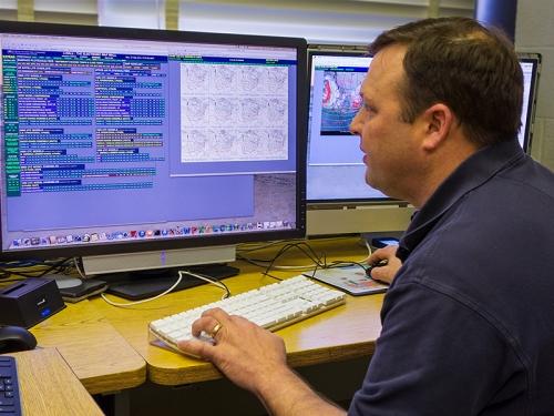 Chuck Pavloski looking at eWall on his computer screen