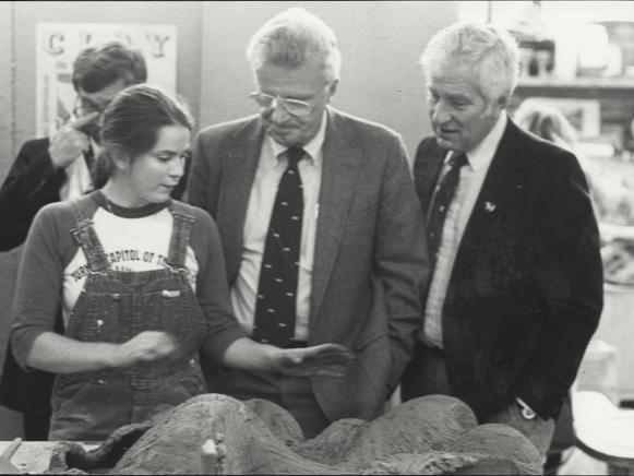 Ceramics Student Explains Her Work to Board of Trustees Members, 1984