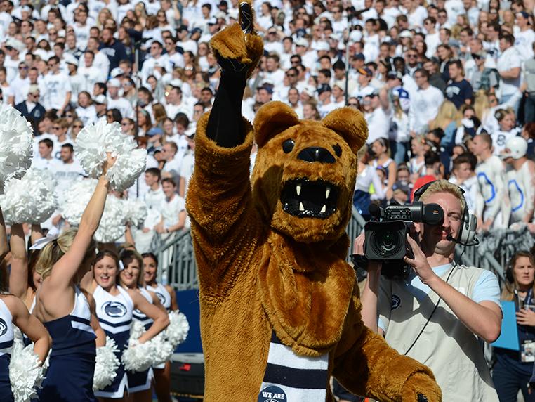 Nittany Lion pointing up at football game