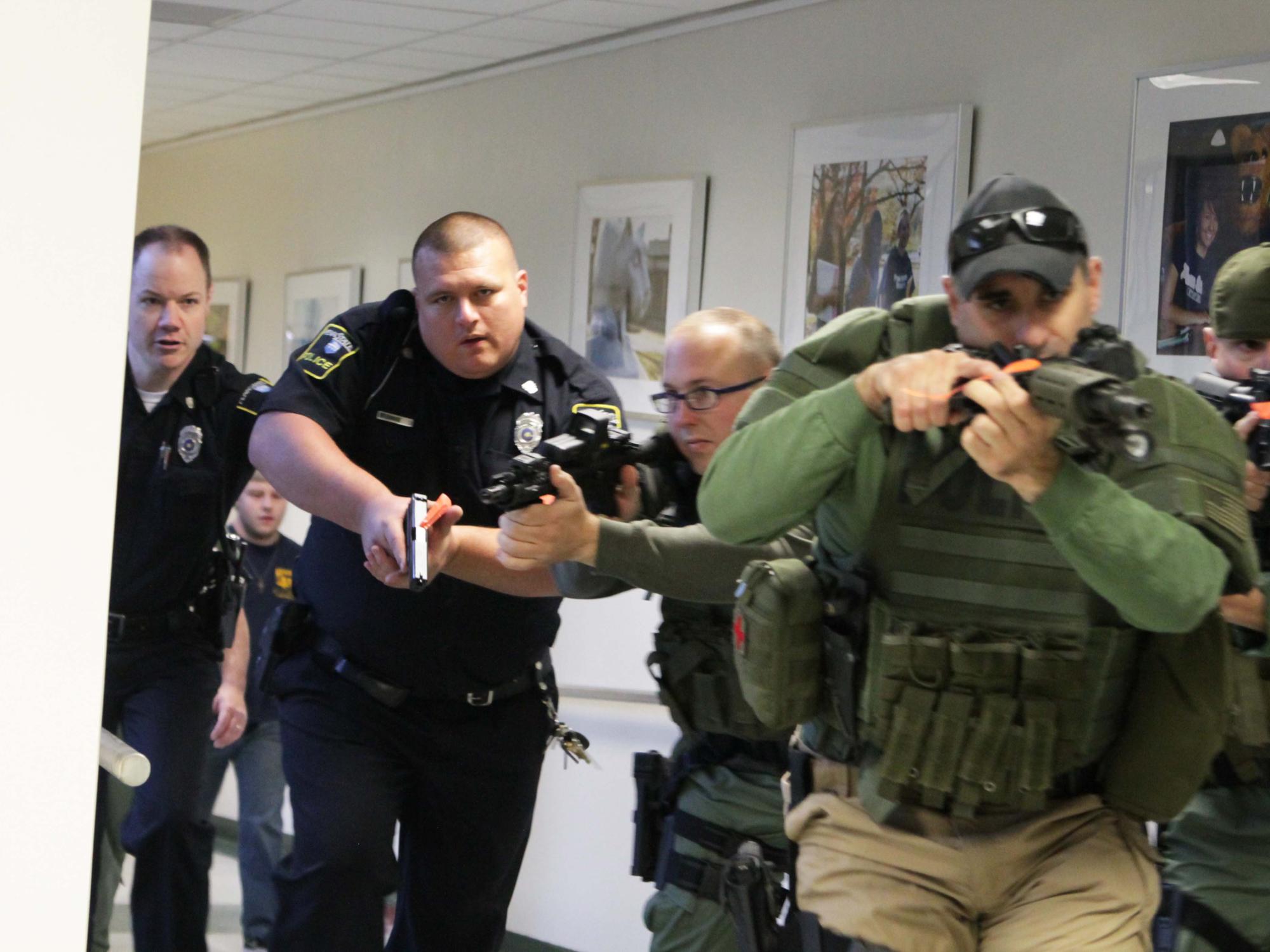 University police enter the Student Union Building during a training drill