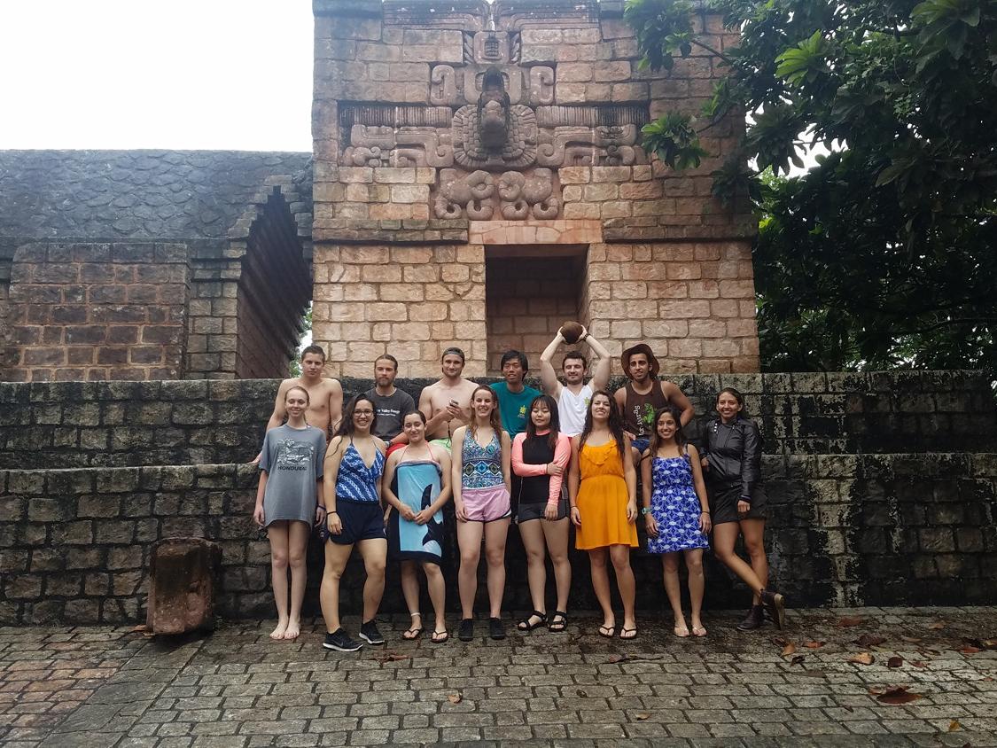 students stand next to ruins in Punta Gorda, Honduras