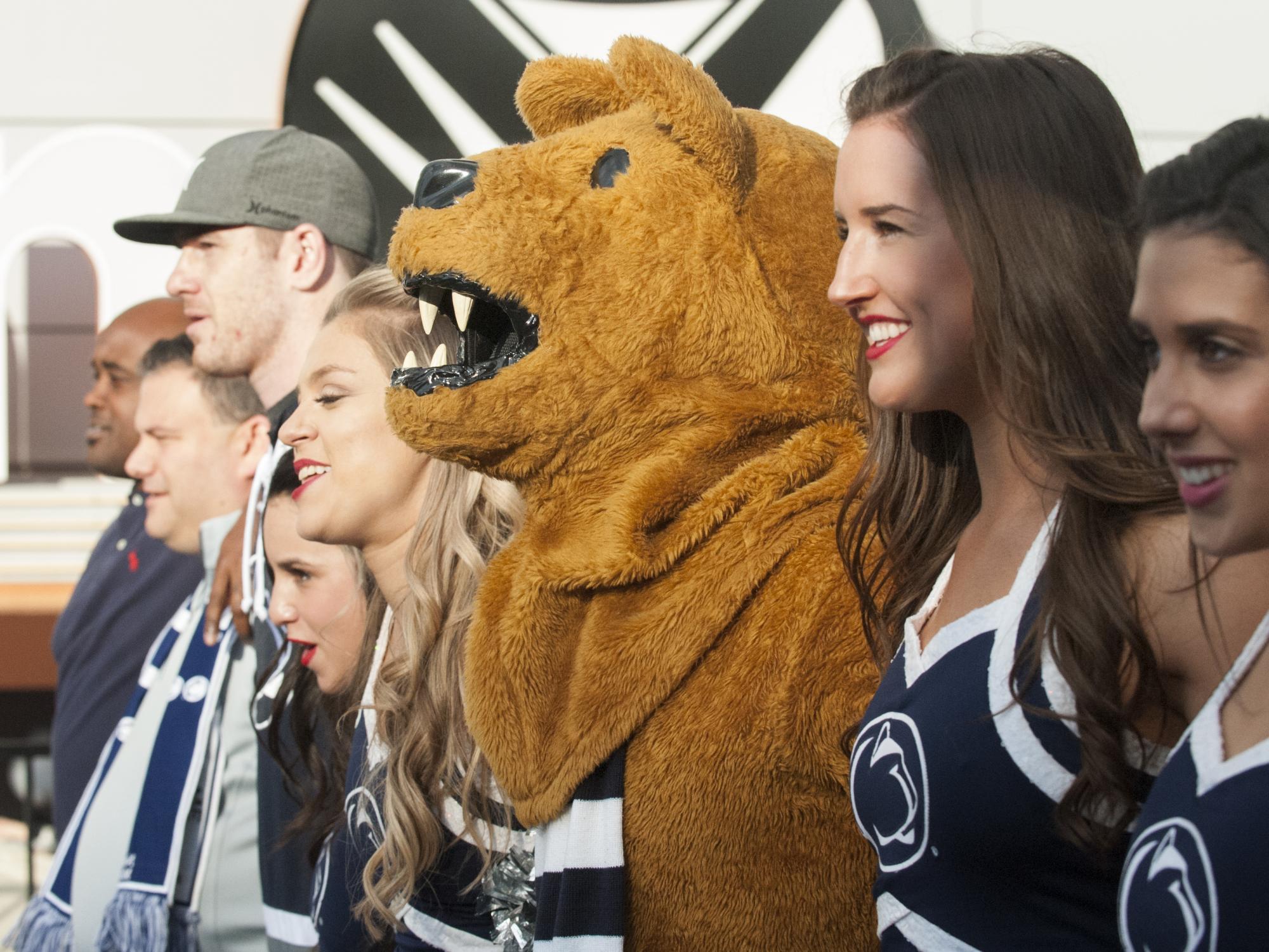 Lion and cheerleaders