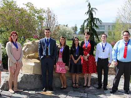 students in front of Lion