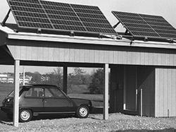 Car parked under a building awning 